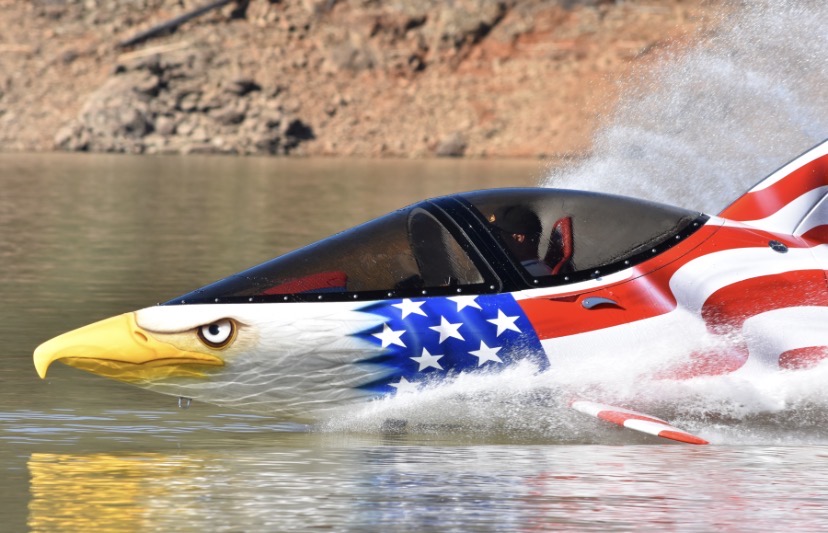 Seabreacher submersible diving with underwater view of pilot and passenger through canopy